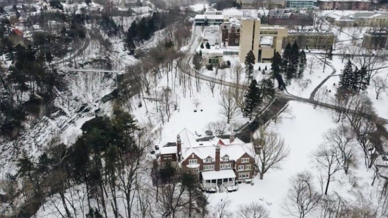 picture from above of frat house in the winter